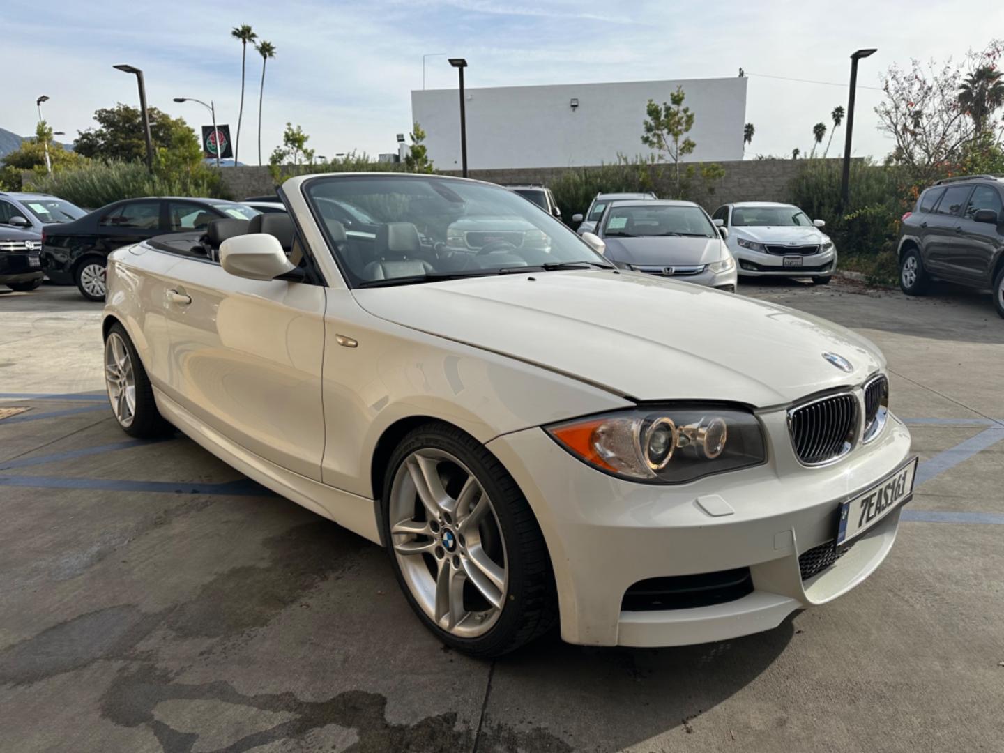 2011 WHITE /Black BMW 1-Series 135i Convertible (WBAUN7C56BV) with an 3.0L L6 DOHC 24V engine, Automatic transmission, located at 30 S. Berkeley Avenue, Pasadena, CA, 91107, (626) 248-7567, 34.145447, -118.109398 - Experience the Ultimate Driving Pleasure: 2011 BMW 135i Convertible Now Available in Pasadena, CA Discover the thrill of open-air driving with the 2011 BMW 135i Convertible, a perfect blend of luxury and performance, now featured at our BHPH dealership in Pasadena, CA. This exquisite convertible - Photo#16